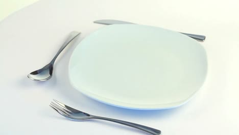 plate, fork, knife and spoon turning