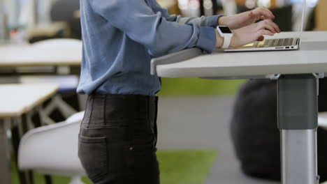 businesswoman using laptop while exercising on treadmill 4k