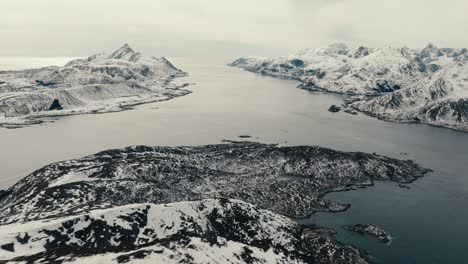 snowy mountains, offersøykammen hiking area in norway during winter - aerial drone shot