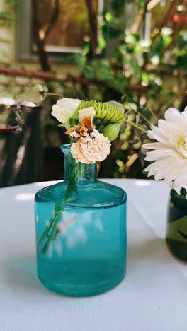 teal vase with dried flowers