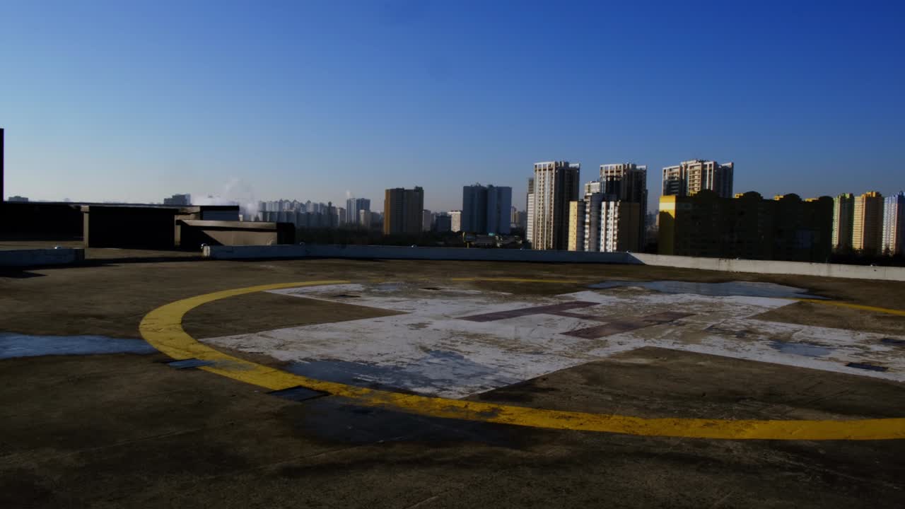 View of the helipad on the roof of a building in the city.