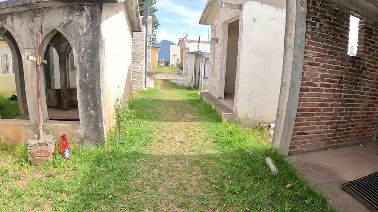 Daytime Walk Through a Traditional Mexican Cemetery in a Quiet Town