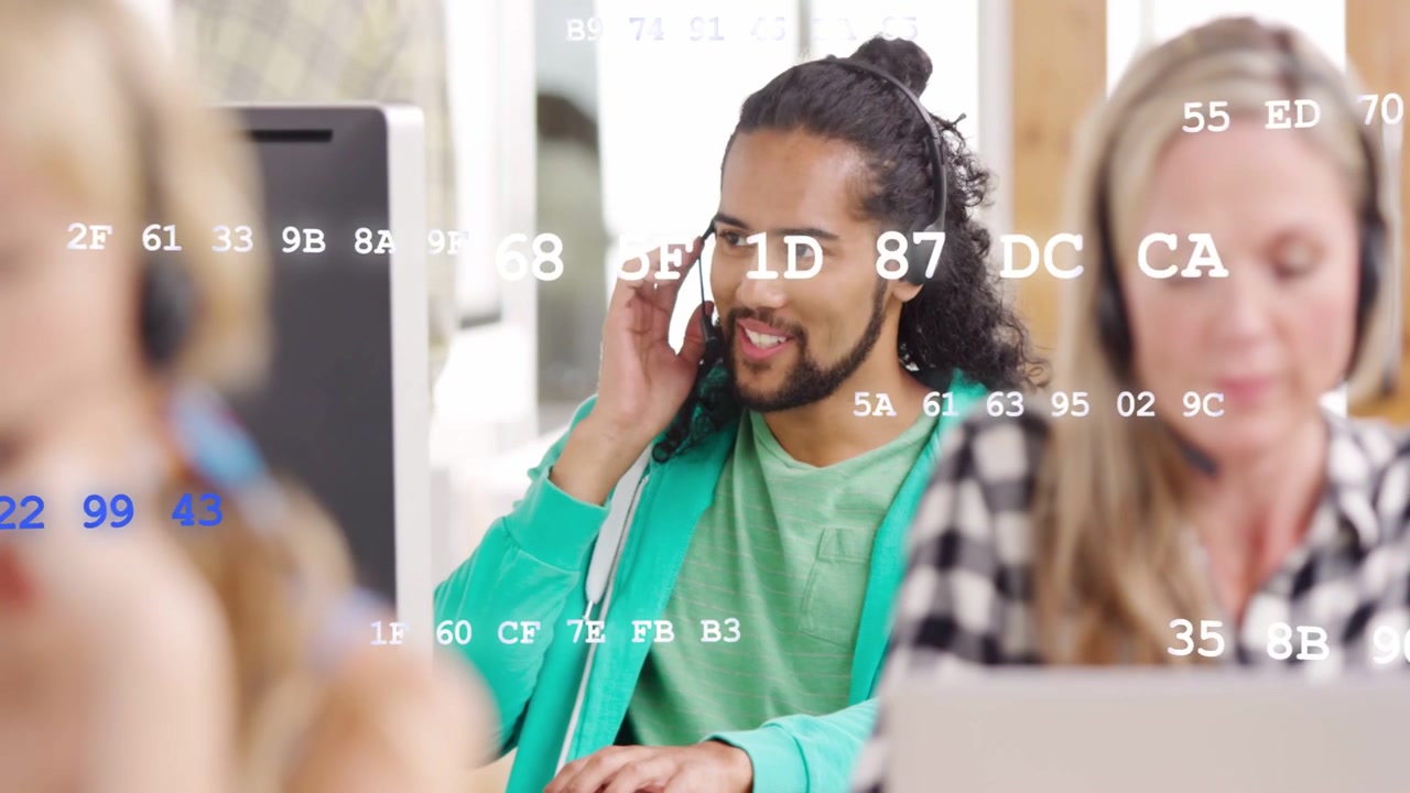 Male call agent hearing call, adjusting headset, speaking and typing as blue white code floating