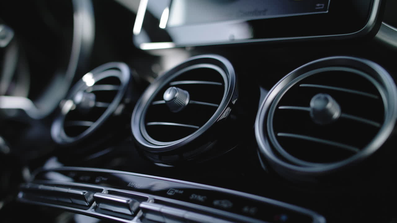 Detail shot of a ventialtion system of a car with black interieur. Merceds Benz GLC.