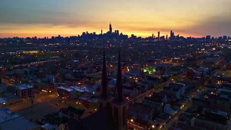 aerial view descending in front of the st paul church, dusk in pilsen, chicago