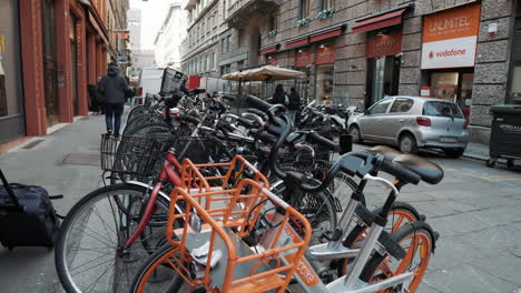 street scene in milan with bikes and people