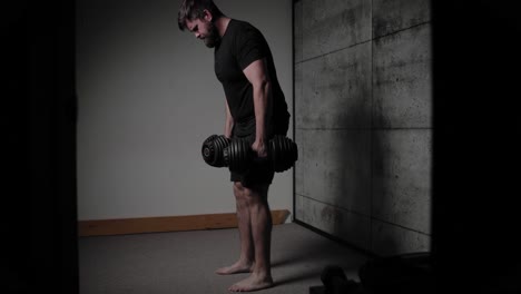 dumbbell bento over row, cinematic lighting, white man dressed in black gym attire