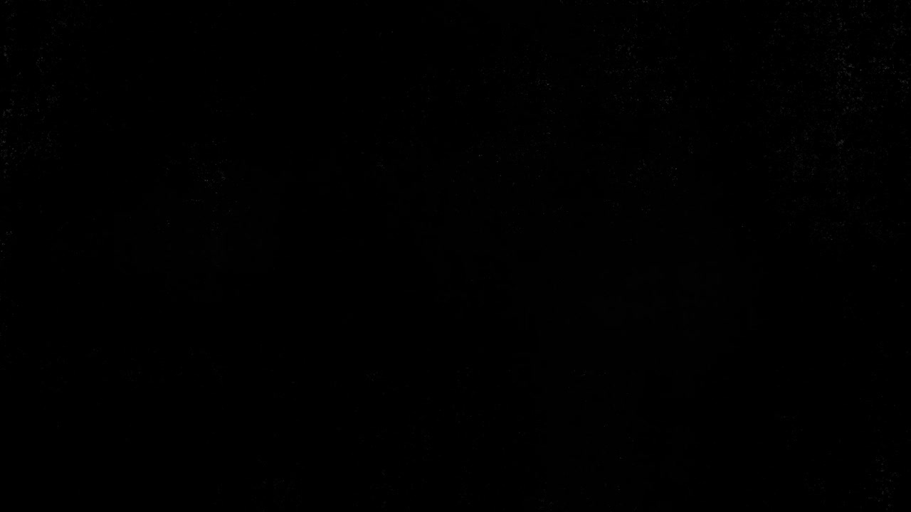 Sfondo nero astratto con sottile texture granulosa
