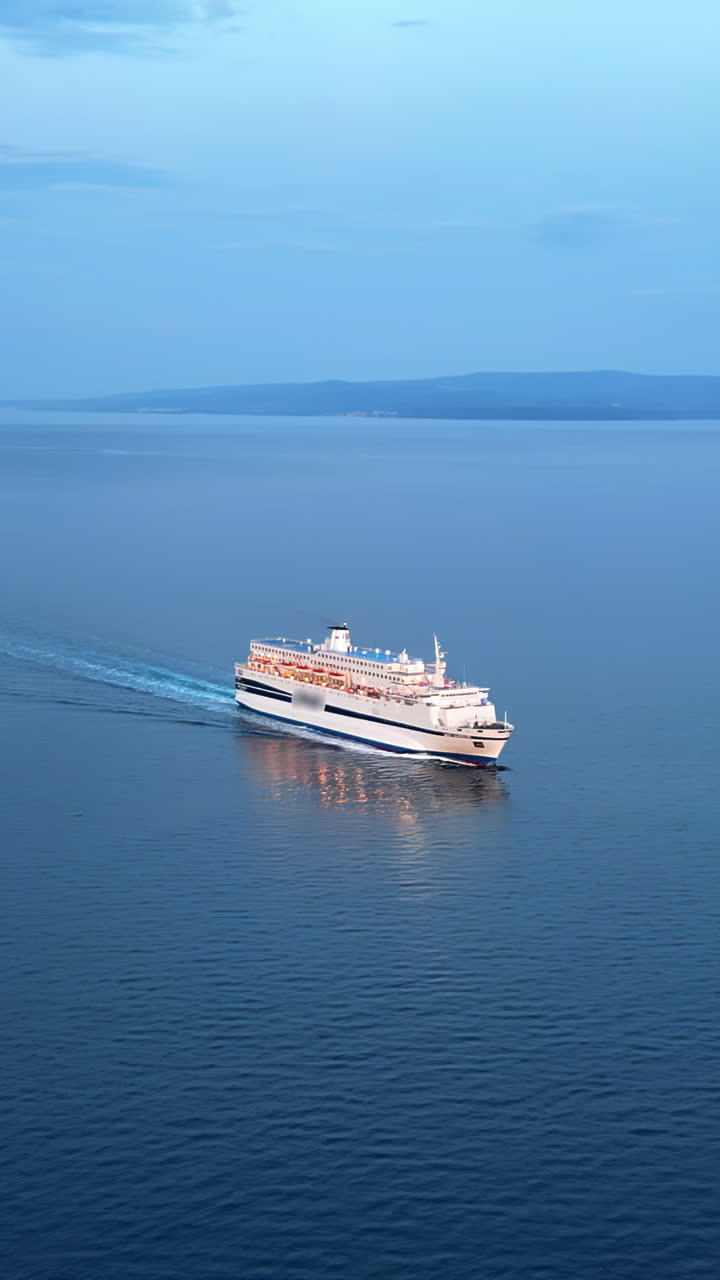 Aerial, drone view of a white boat moving on the the Adriatic sea in Croatia. Vertical