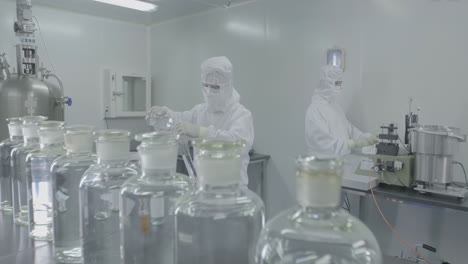 medical scientists or technicians loading a sample to centrifuge machine to analyzing. advanced research lab with modern equipment. drug or vaccine development in professional biotechnology lab