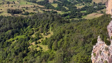 panoramic view of lush greenery and rock formations under bright daylight in nimbin, nsw, australia