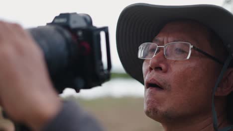 photographer focusing on camera