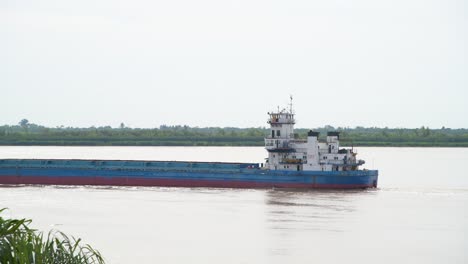 A-closeup-shot-of-a-seavessel-sailing-along-the-bank-of-Paraná-river,-Argentina