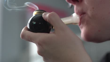 Female-With-Smoking-Pipe---close-up-shot