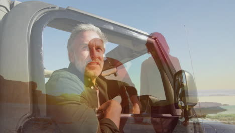 sitting in car, man observing animation of people standing outside in sunlight