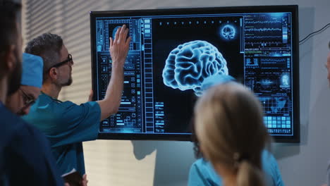 medical professionals reviewing brain scan data