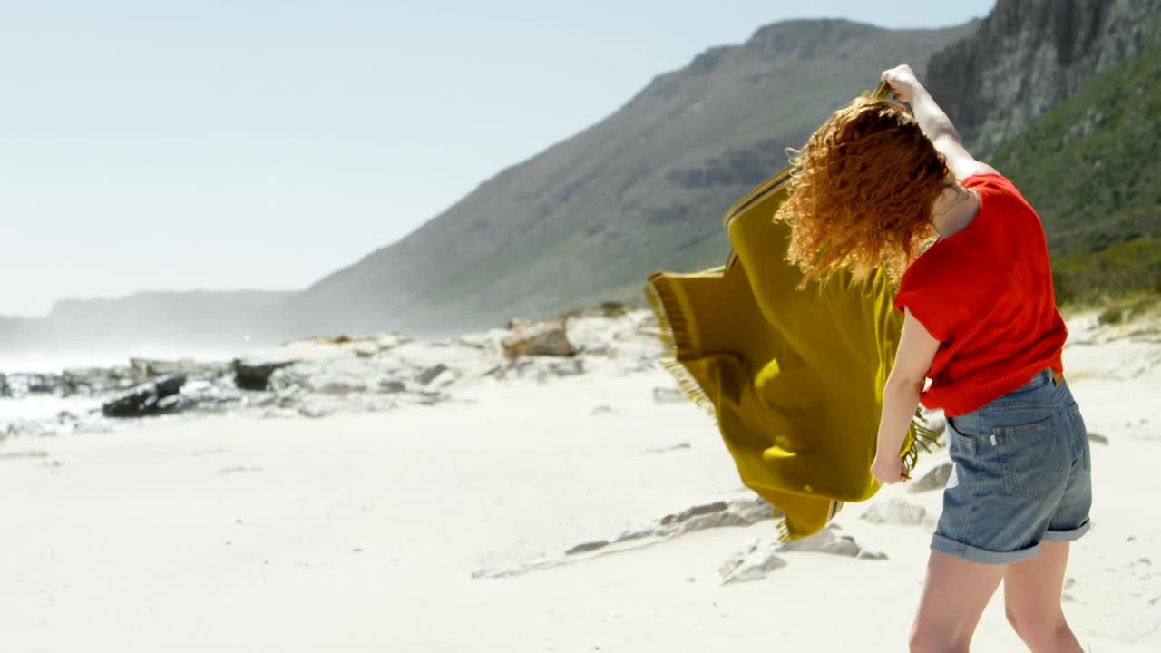 Carefree woman holding shawl against the breeze 4k
