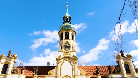 beautiful clock and bell tower of loreta monastery in prague, czech republic