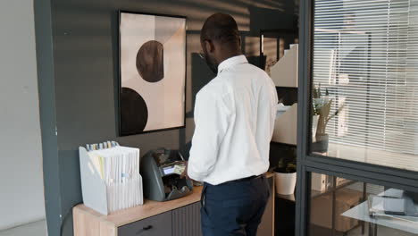 businessman counting money in modern office