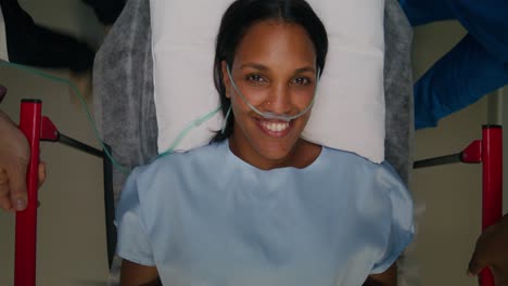 woman in hospital stretcher with oxygen