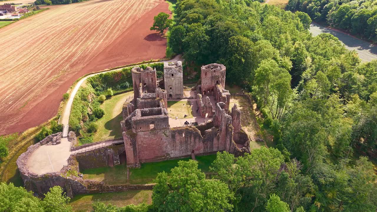 Aerial drone footage orbiting the medieval ruins of Goodrich Castle in Herefordshire