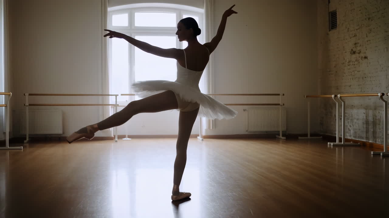 Graceful Ballerina Silhouette Practicing in a Ballet Studio