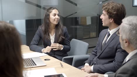 cheerful business team communicating in conference room