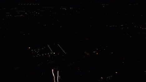 Aerial-view-of-fireworks-during-4th-of-July-celebration-in-Tooele,-Utah