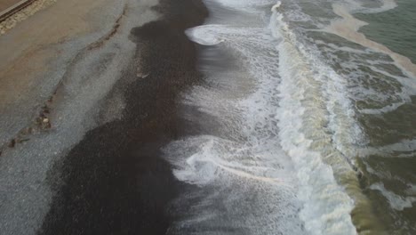 drone video of a rocky beach shore