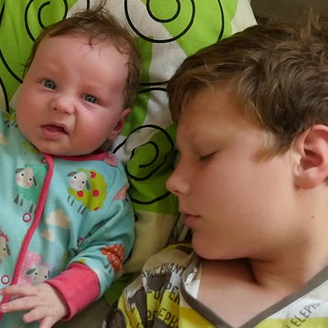 two sleeping brothet kids