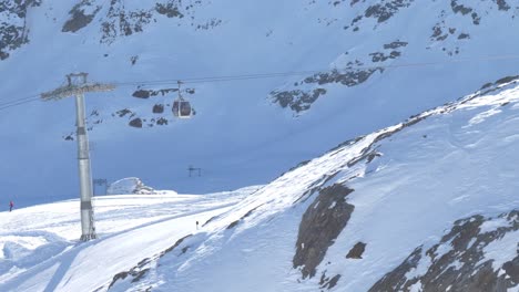 ski lifts moving up and down in the highlands of sunny kaunertal, winter in austria - static view