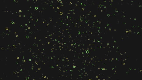 Scattered-blue-and-green-dots-create-dynamic-pattern-on-black-background