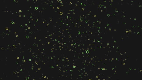 scattered blue and green dots create dynamic pattern on black background