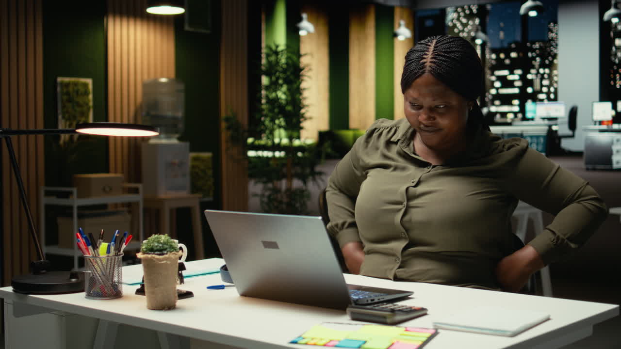 Office worker engaged in tasks listening to ambience music or a podcast