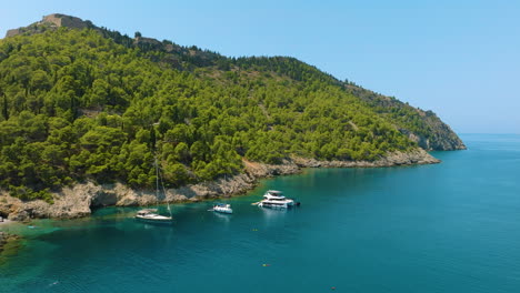 coastal view with boats and mountainous landscape