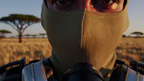 person in protective gear in a desert landscape
