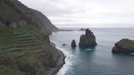 Aerial-view-of-Islets-of-Ribeira-da-Janela,-an-impressive-rock-formations-that-mark-the-seascape