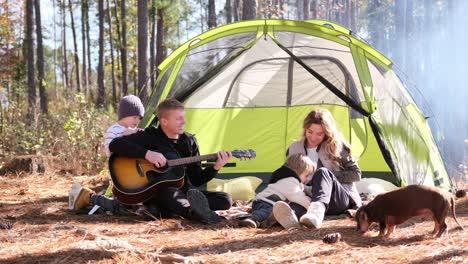 enjoying a family camping adventure together while having a fresh produce spread outdoors kids are joyfully enjoying a delightful camping trip filled with fresh fruits and vegetables at a picnic table