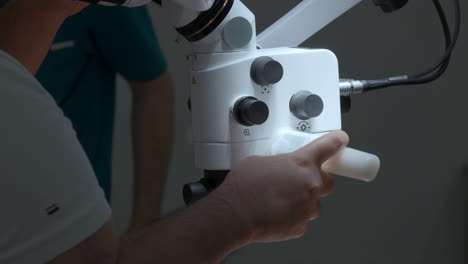 dentist using microscope