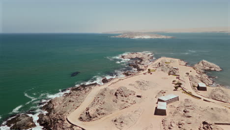 aerial view of a coastal landscape with rocky shore and ocean