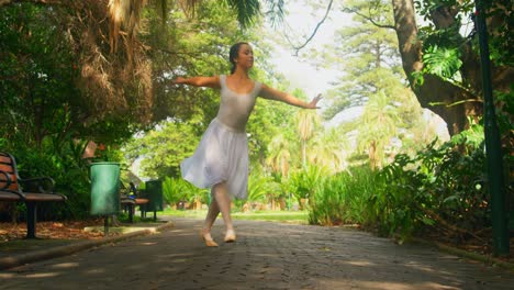 young ballerina dancing in the park 4k