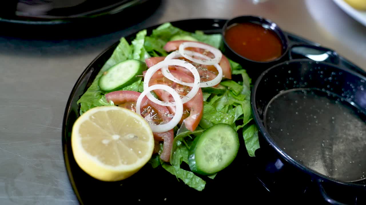 Fresh and vibrant salad delighting the senses at a cozy eatery on a sunny afternoon