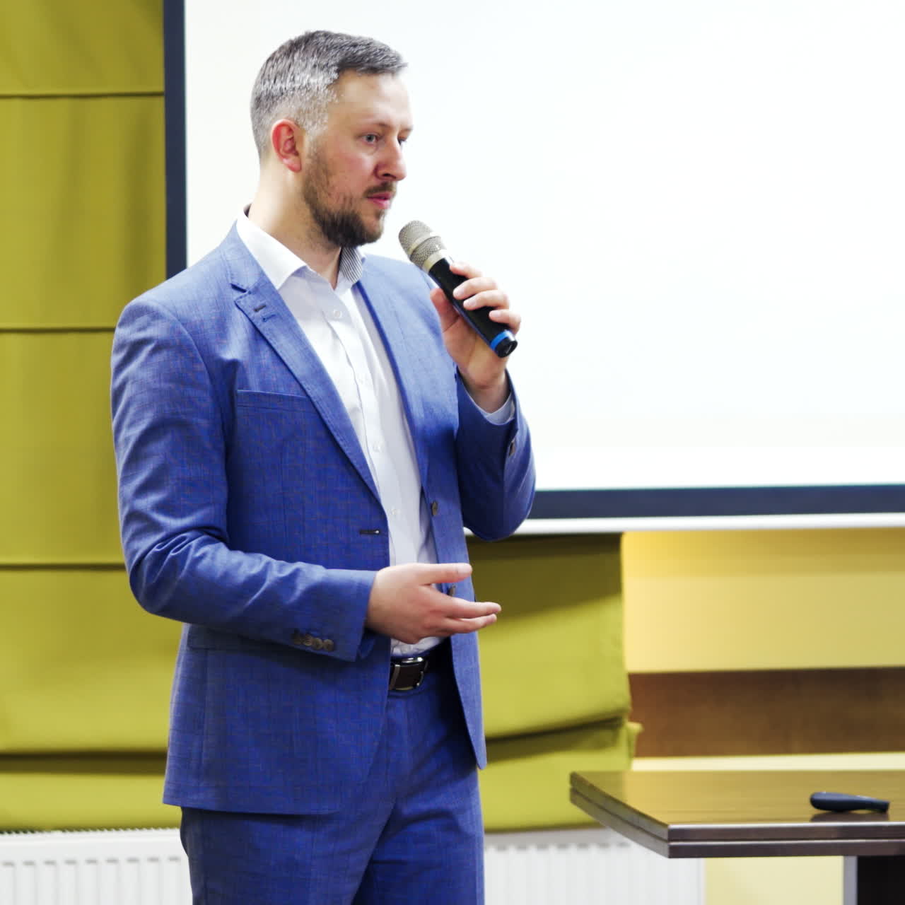 young businessman at business conference room with public giving presentations. Audience at the conference hall. Entrepreneurship club