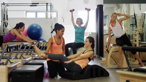 Beautiful-women-exercising-in-fitness-studio