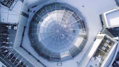 snowy aerial view of a glass dome