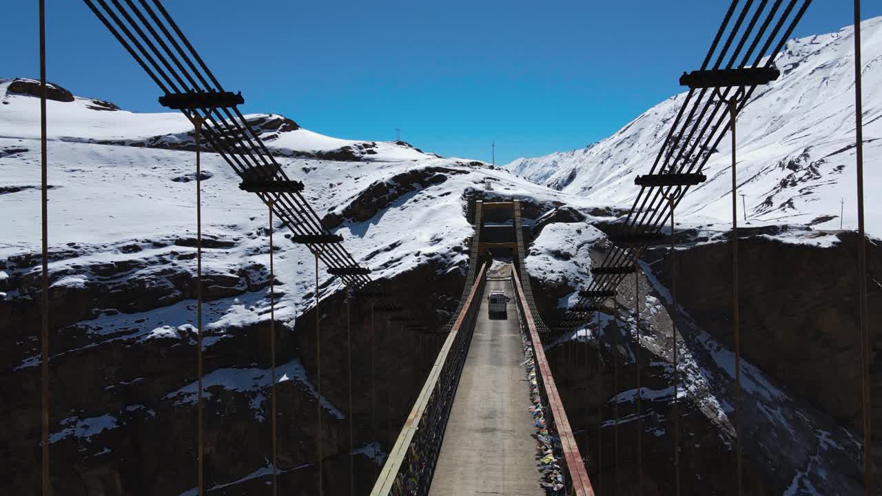 drone fly above Asia's highest Chicham Bridge in spiti himachal pradesh India with Himalayan mountains landscape covered in snow