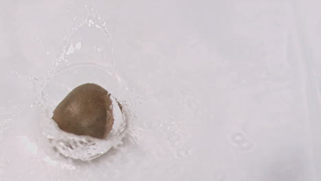 kiwi falling into water in super slow motion