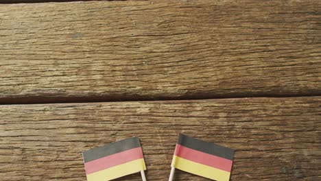 Video-of-flags-of-germany-on-wooden-background