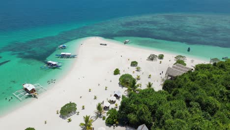 aerial dolly reveal banca outrigger beached on patawan island balabac