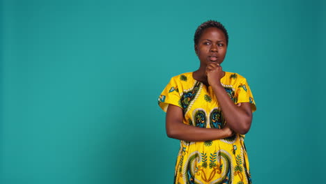 Charming-sweet-woman-thinking-intensely-about-something-in-studio